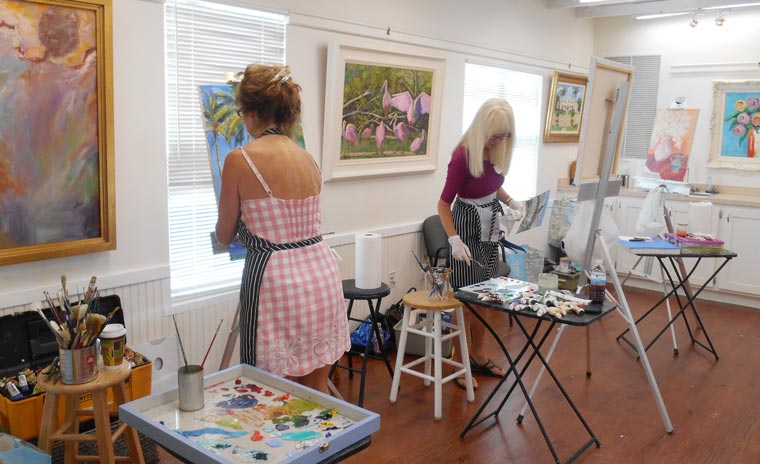Two women participating in a painting class